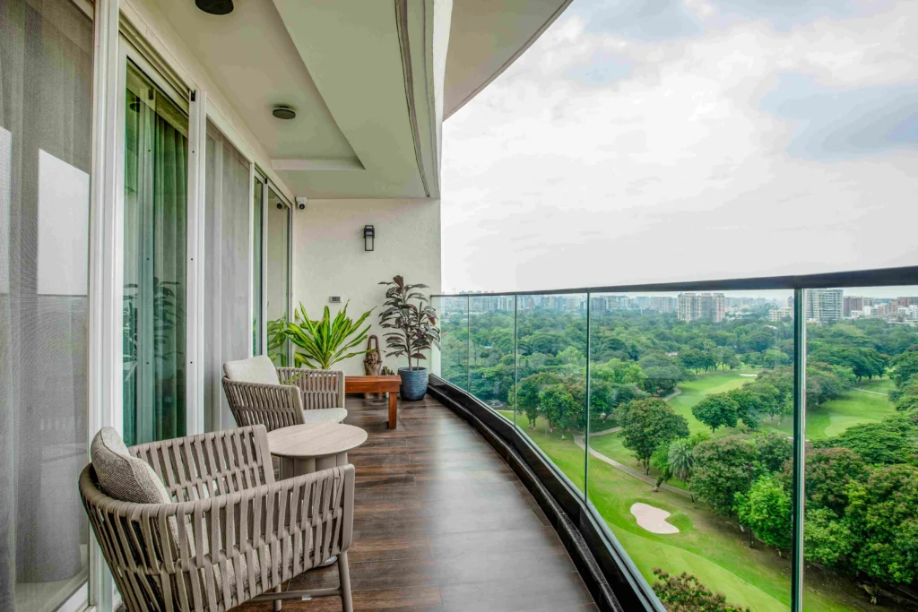 Spacious balcony with lush greenery and open scenic view